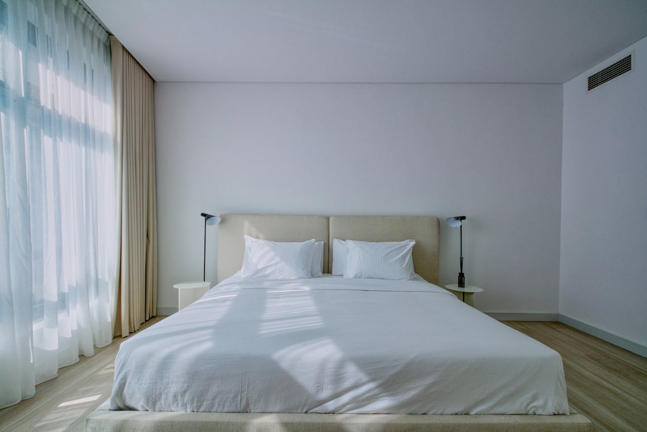 services-img A stylish, airy bedroom interior with soft natural light and elegant furnishings.