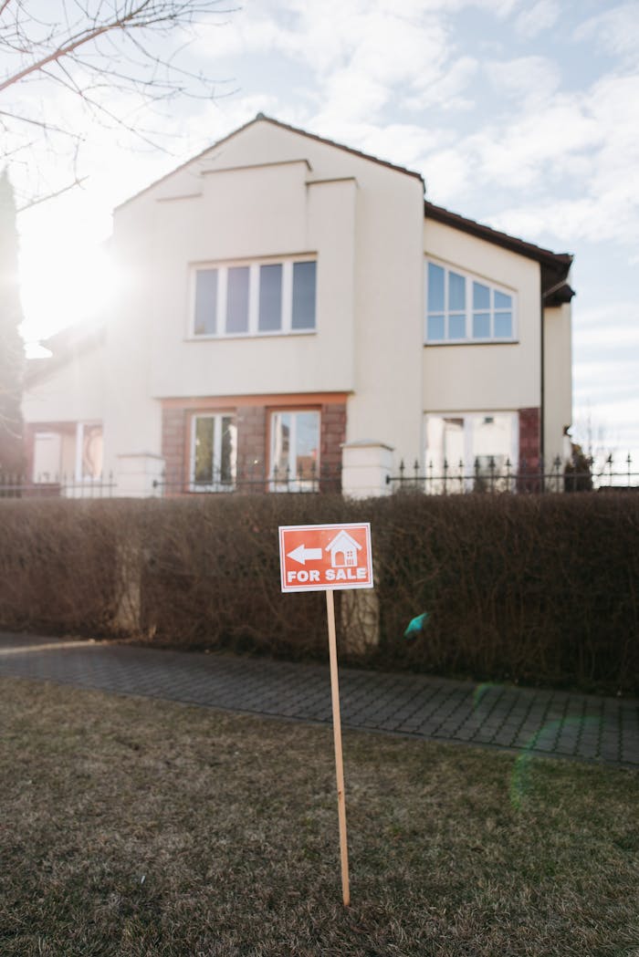 services-02 Exterior view of a suburban house with a clear for sale sign. Perfect for real estate promotion.
